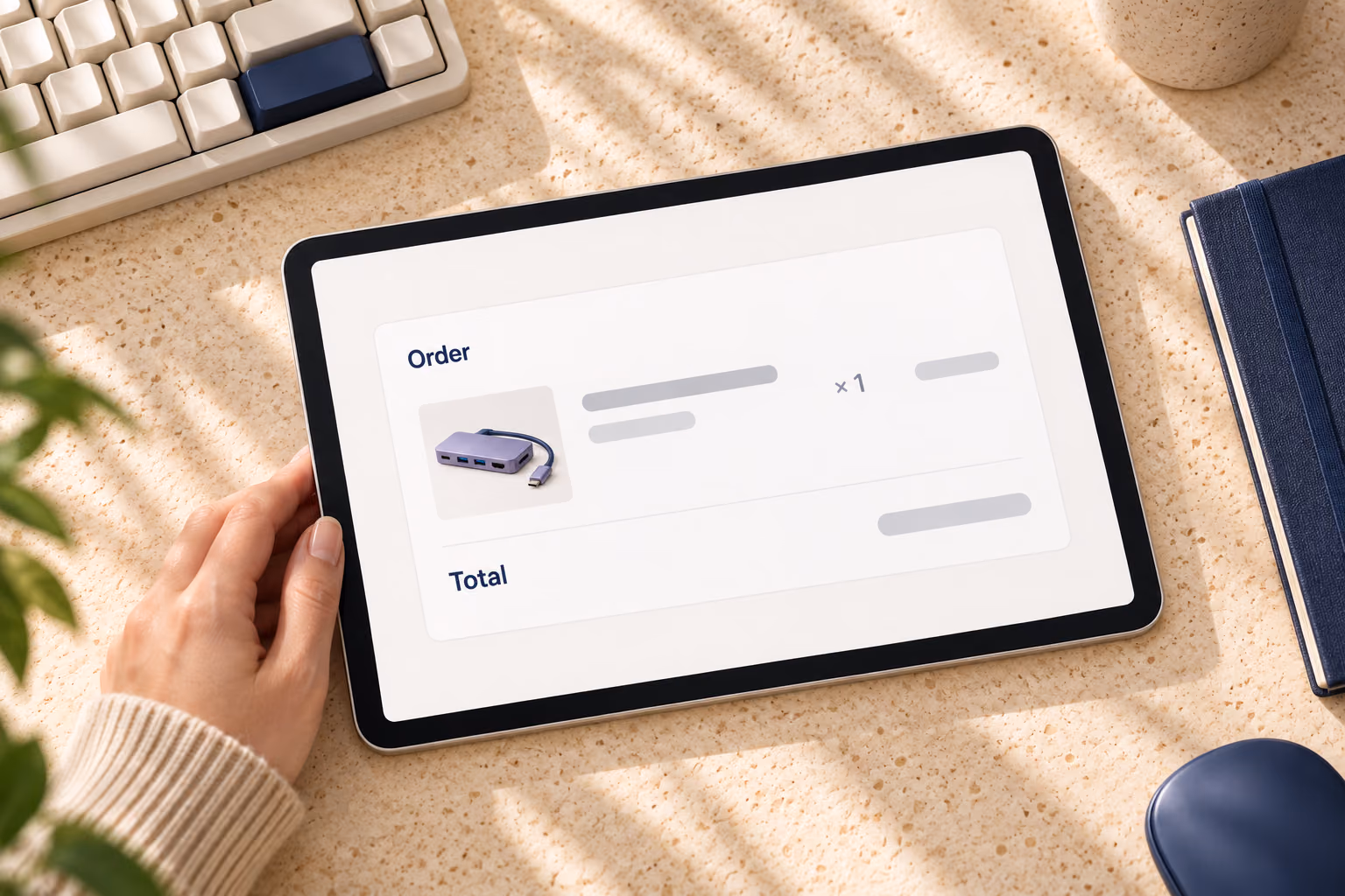 Top-down tablet view of a conceptual order summary and total